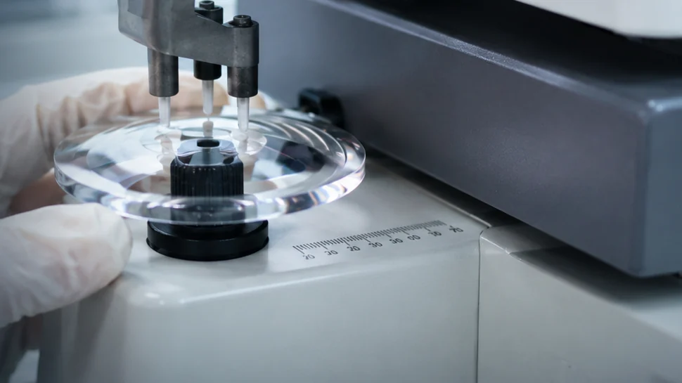 Precision optical lens inspection in a clean manufacturing lab
